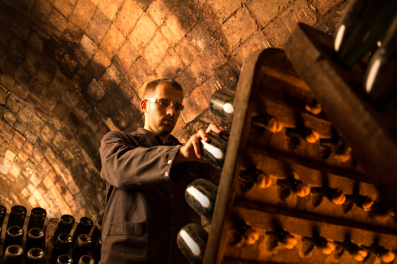 Turning bottles during the riddling process. Recaredo